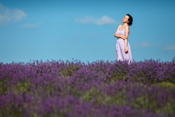 Fototapeta na wymiar Beautiful provence woman in lavender field