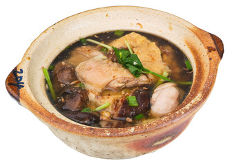 Chicken and herb soup in pot, Chinese food style.
