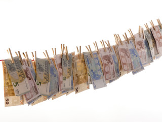 many euro banknotes on a clothesline - 58055860