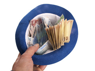 Euro banknotes in a hat - 58055864