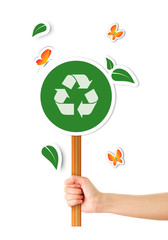 Hand holding ecological sign