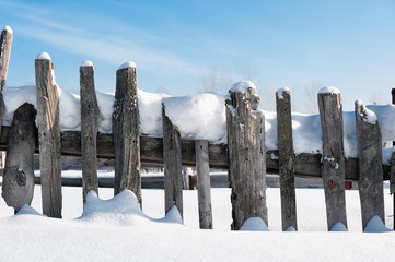 Old fence in the snow