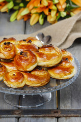 Traditional swedish buns in autumn setting. A saffron bun