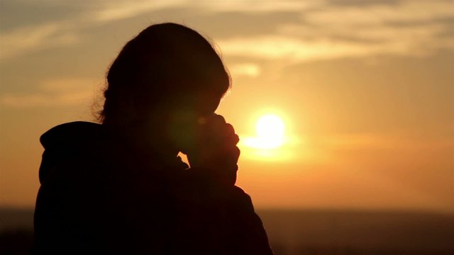 girl silhouette at dawn (close-up)