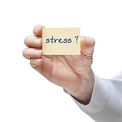 Hand mit Notiz, Zettel mit Text: Stress.