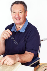 Man sitting in a wheelchair at the table