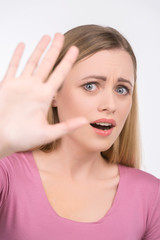 Fototapeta premium Blond girl saying no looking at camera.