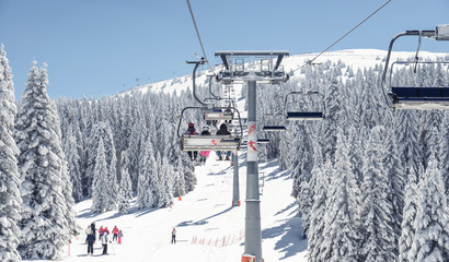 Chair-lift at ski resort - obrazy, fototapety, plakaty