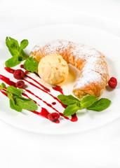 strudel with ice cream decorated with mint leaves