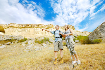 Adult man and woman are hiking