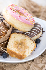 Heap of mixed Muffin and Donuts