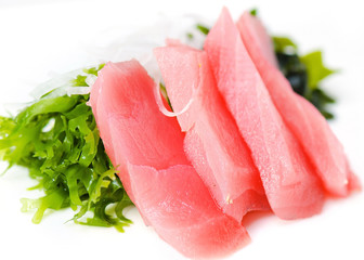 pieces of tuna and salad on white