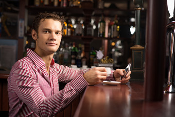 man with a cup of coffee