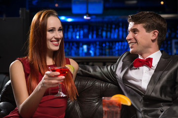 Young couple talking in a nightclub