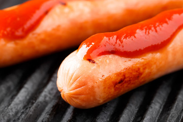 Sausages on a grill
