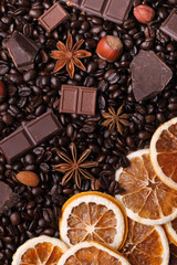 Background of coffee beans, chocolate chips, spices, nuts and ca