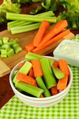 Fresh green celery with vegetables in bowl on table close-up