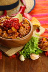 Chili Corn Carne - traditional mexican food, in wooden bowl,