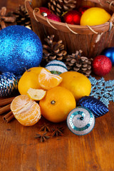 Christmas tangerines and Christmas toys on wooden table