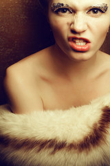 Furious superstar undressed holding luxurious furs