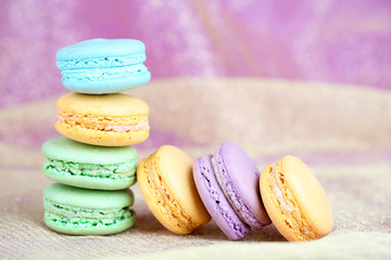 Macaroons on fabric background