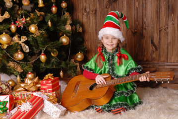 Girl - the Christmas elf with a guitar