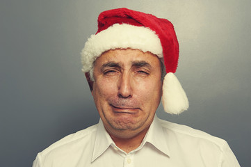 senior man in red santa hat