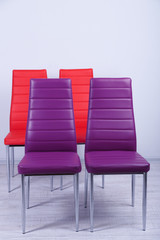 Modern  color chairs on wall background