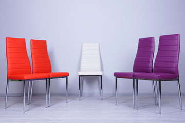 Modern  color chairs on wall background