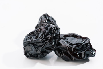 group of prunes on white base