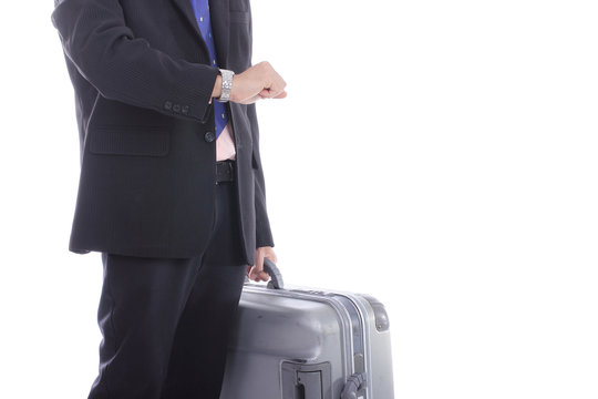 Businessman hold baggage and watch time