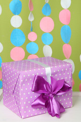 Beautiful present on table on bright background