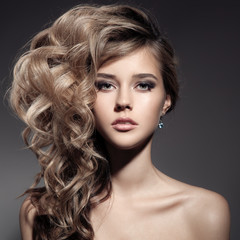 Beautiful Blond Woman. Curly Long Hair