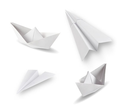 set of paper ships and paper planes on white