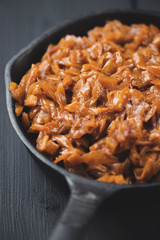 Cast-iron pan with braised cabbage, vertical shot, close-up