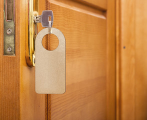 key in keyhole with blank golden label