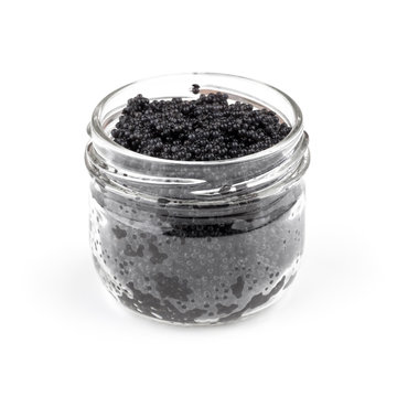 Black caviar in a glass jar isolated on white background