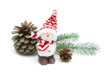 toy snowman and pine cones on a white background close-up