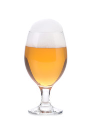 Closeup of beer glass with foam.