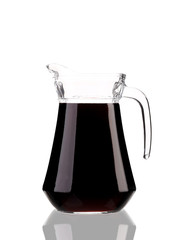 Pitcher of red wine with reflection.