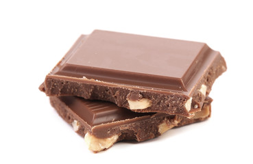 Two broken chocolate bars with nuts.