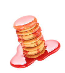 Stake biscuit sandwich with red syrop.