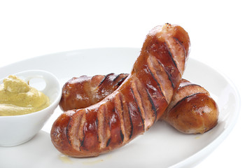 Delicious fried sausage on plate