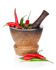 Wall murals Herbs Mortar and pestle with red hot chili pepper and peppercorn