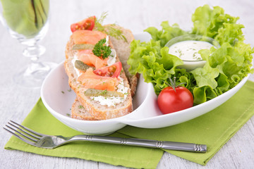 bread with salmon and salad