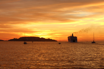 Cruise ship in port of Marseille at sunset - France  