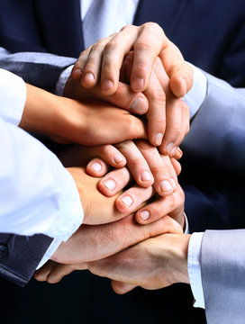 Closeup Of A Business Colleagues With Their Hands Stacked