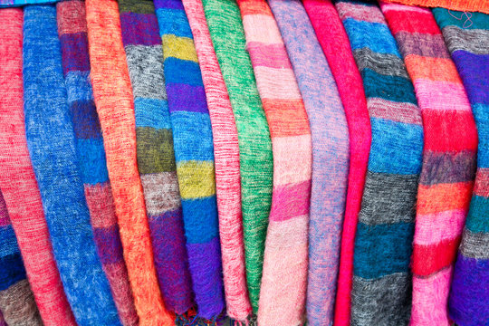 Pile of gentle folded shawls (scarfs) at the market, Nepal.