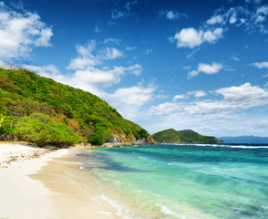 Fototapeta na wymiar White sand beach. Malcapuya island, Philippines