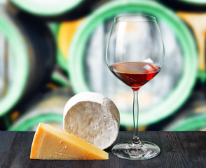 Glass of wine and cheese in winery